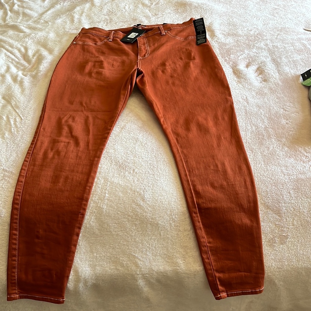 Lilac stretch skinny Jean. These are in a rust orange color w/ white stitching.